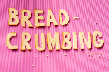Breadcrumbing spelled out with breadcrumbs to visualize breadcrumbs for SEO